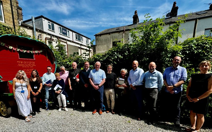 image shows pride in place board members following a board meeting on a sunny day in waterfoot