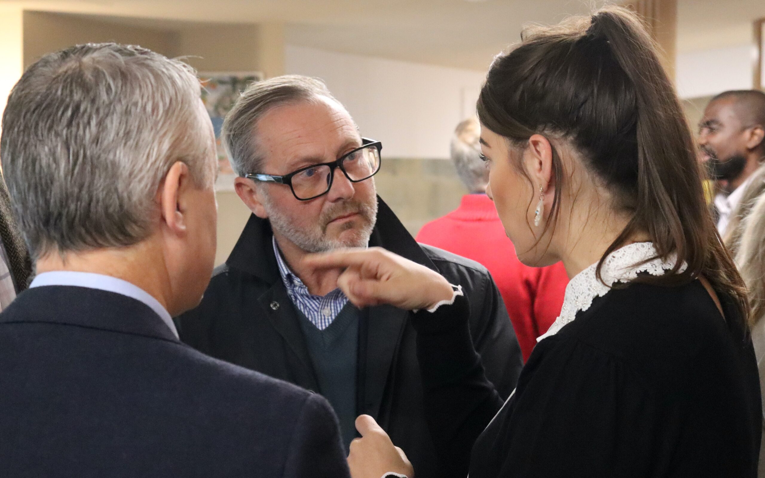 Attendees networking and sharing ideas at the event